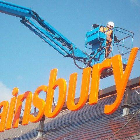 Pressure washing a store roof