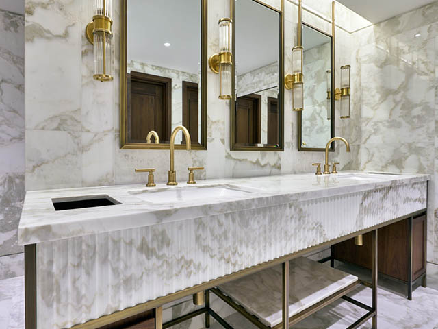 Fluted marble vanity top and wall cladding
