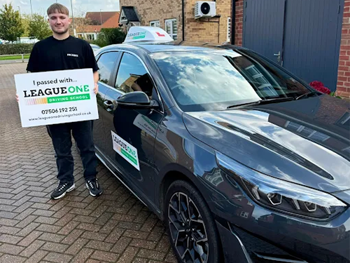 Learner driver celebrating test pass success
